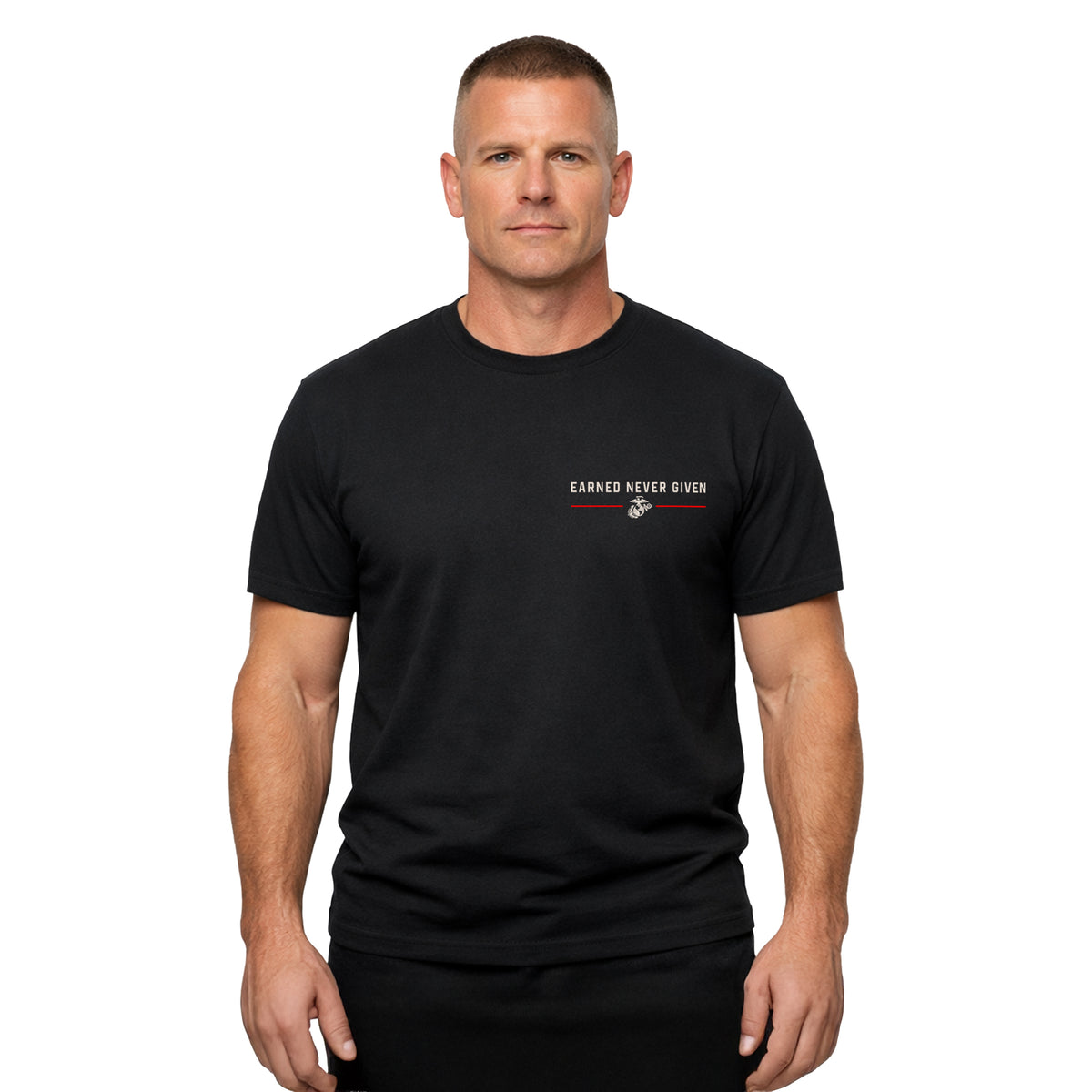 man wearing Black USMC Earned Never Given Red Line T-Shirt with left-chest lettering, Eagle, Globe and Anchor, and red accent lines