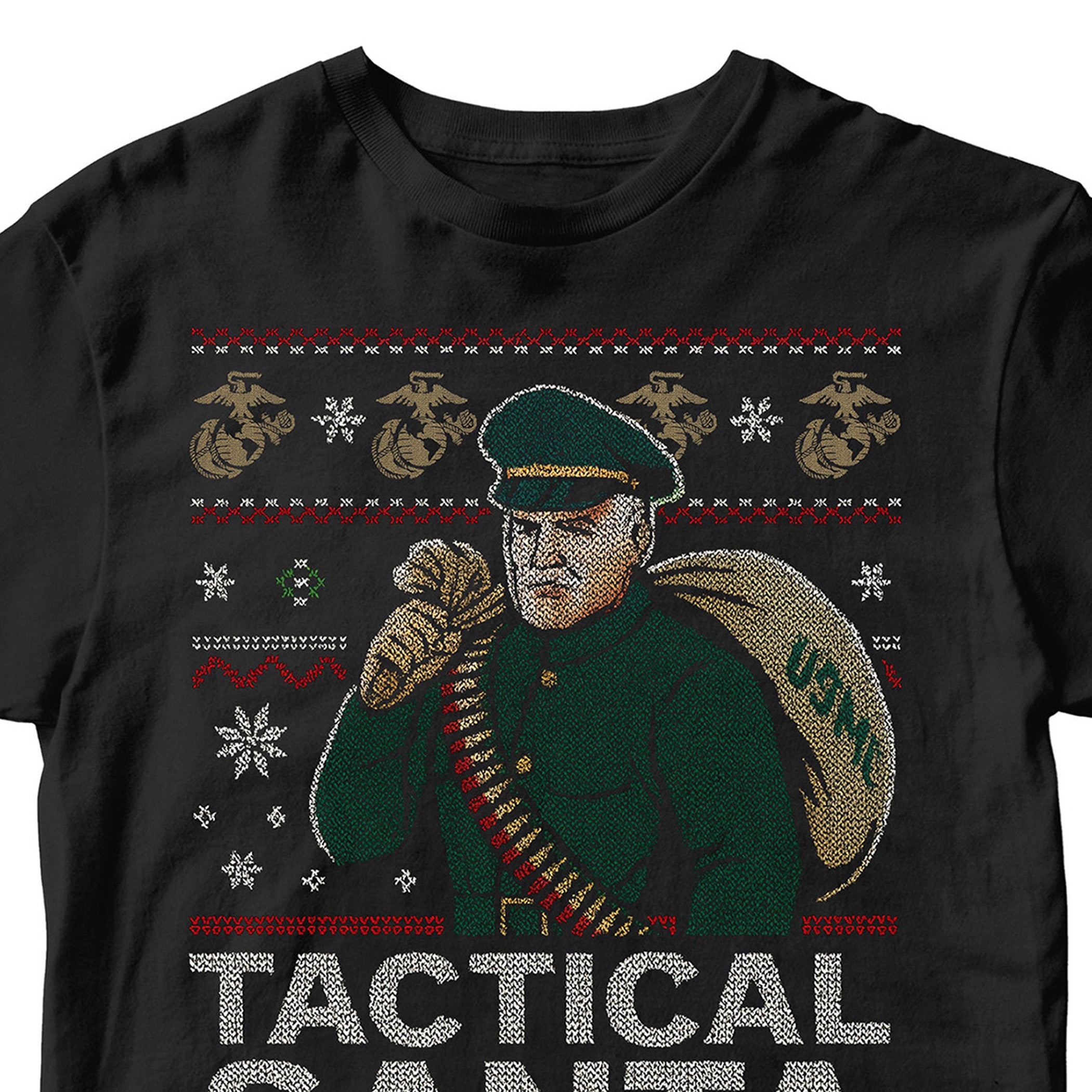 Black USMC Christmas T-shirt featuring a knitted-style Tactical Santa carrying a USMC seabag with ammo belt, surrounded by snowflakes, EGAs, and bold text ‘Tactical Santa Drop.’” Marines Christmas Tee