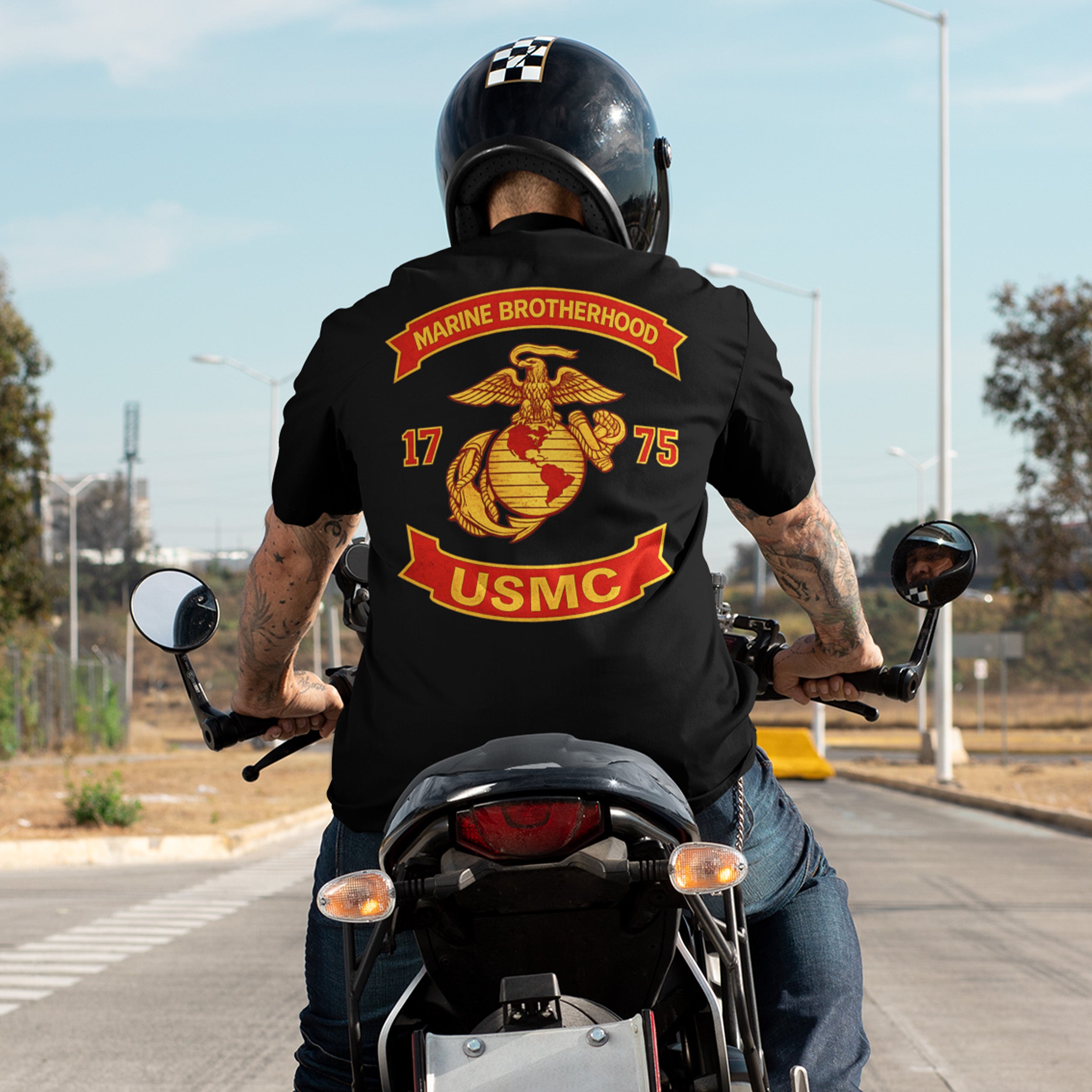 Black USMC T-shirt with large motorcycle club–style back graphic reading ‘Marine Brotherhood,’ ‘1775,’ and ‘USMC. Marines Motorcycle Tee