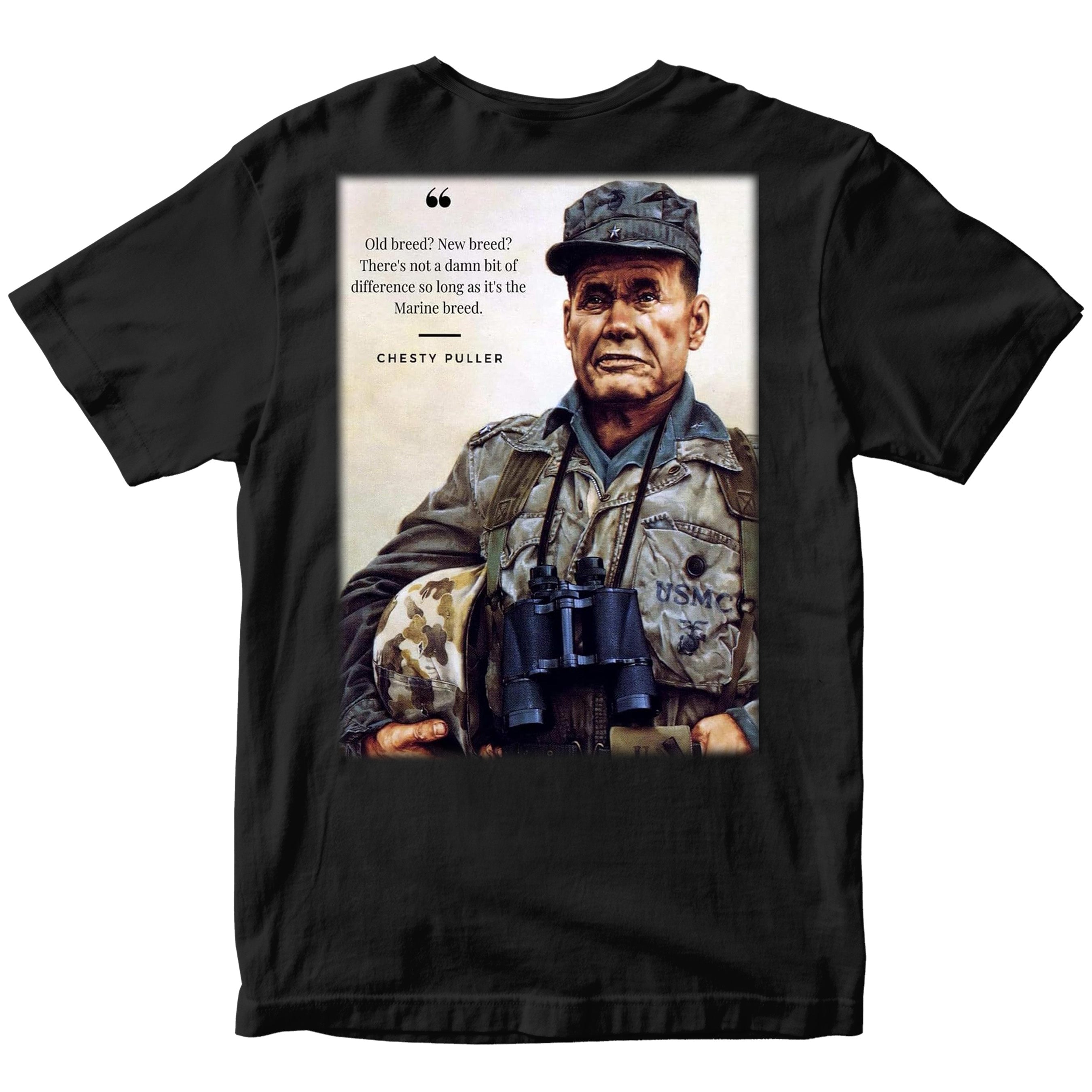 Marines black T‑shirt showing a color portrait of Lt. Gen. Chesty Puller holding a helmet and binoculars, with the quote ‘Old breed? New breed? There’s not a damn bit of difference so long as it’s the Marine breed.’ and ‘Chesty Puller’ below.”