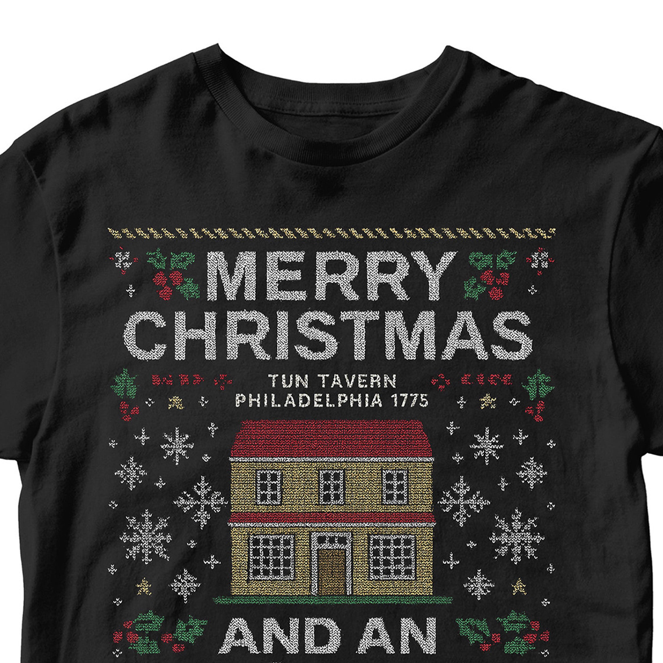 Black USMC Christmas T-shirt with knitted-style Tun Tavern illustration, snowflakes, holly, Eagle Globe and Anchor, and text ‘Merry Christmas’ and ‘And an Oorah New Year.’ Marines Christmas Holiday Tee